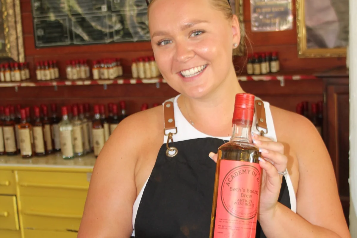 An Academy guest holding her finished rum bottle