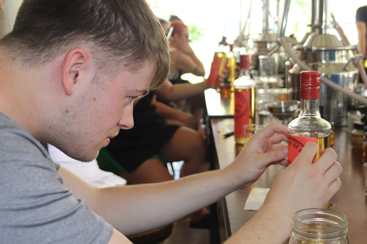 A guest working with their rum bottle during an Academy session