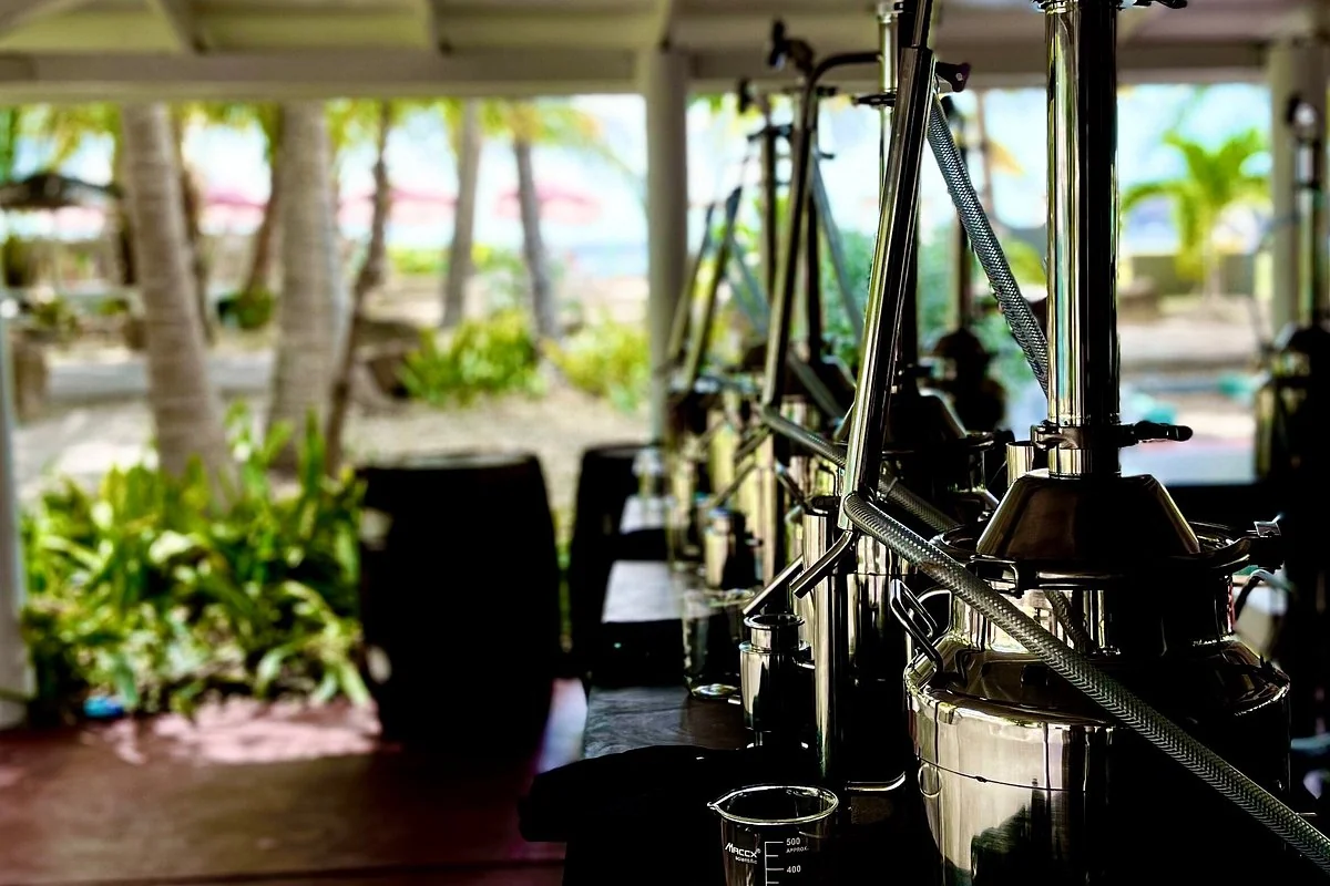 Tabletop stills in the open-air Academy of Rum mini distillery at Galleon Beach